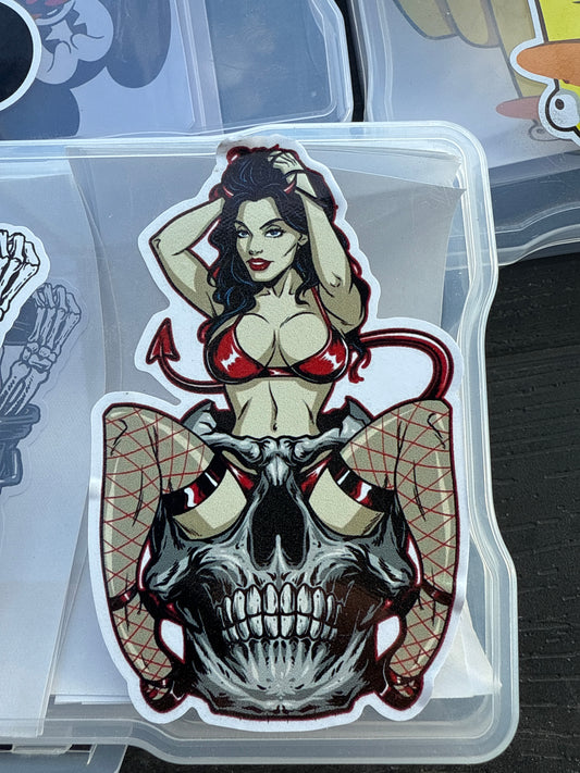 sexy devil sitting in skull